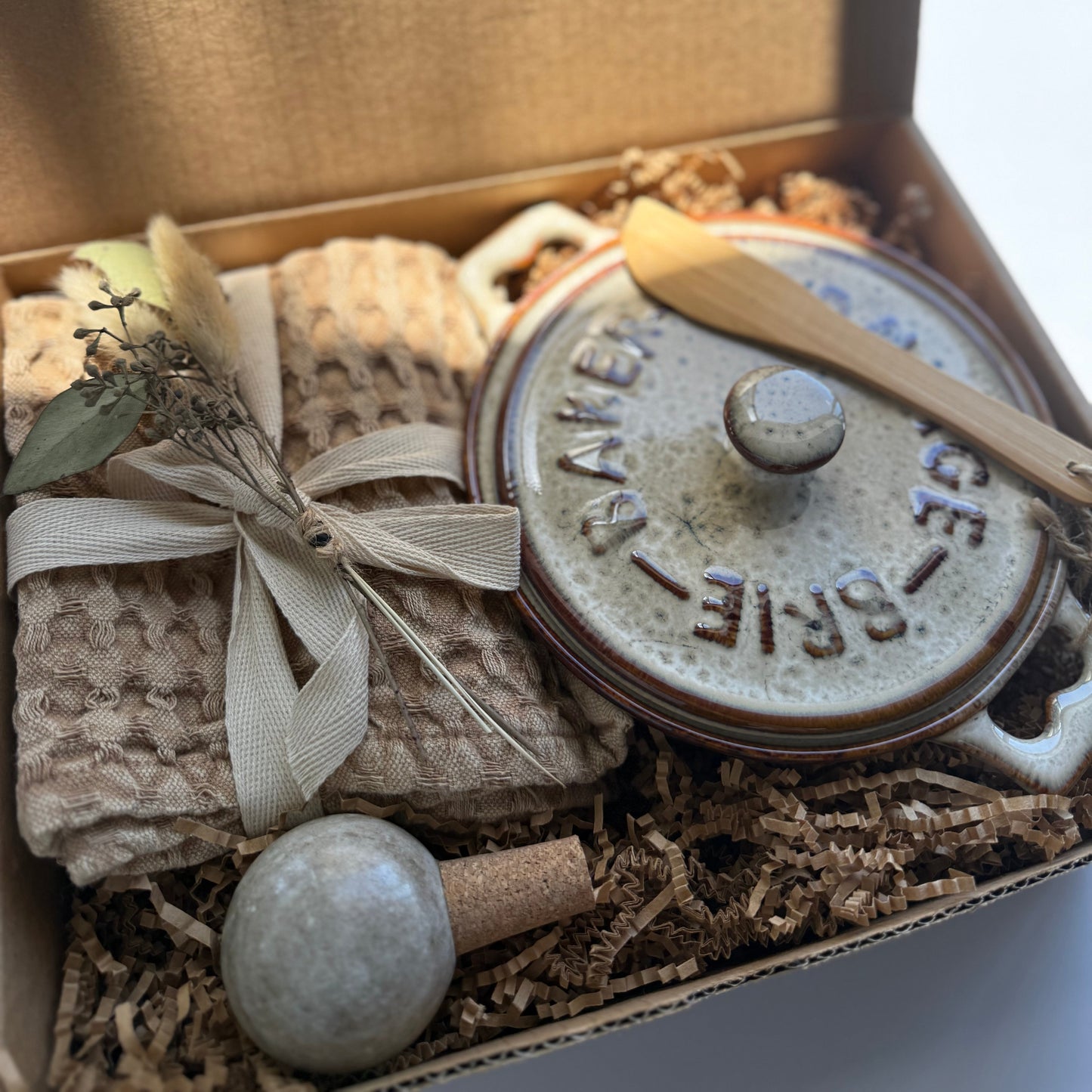 Decorative box with a ceramic pot, ribbon, and decorative elements, featuring 'The Fox and Paffry' branding.