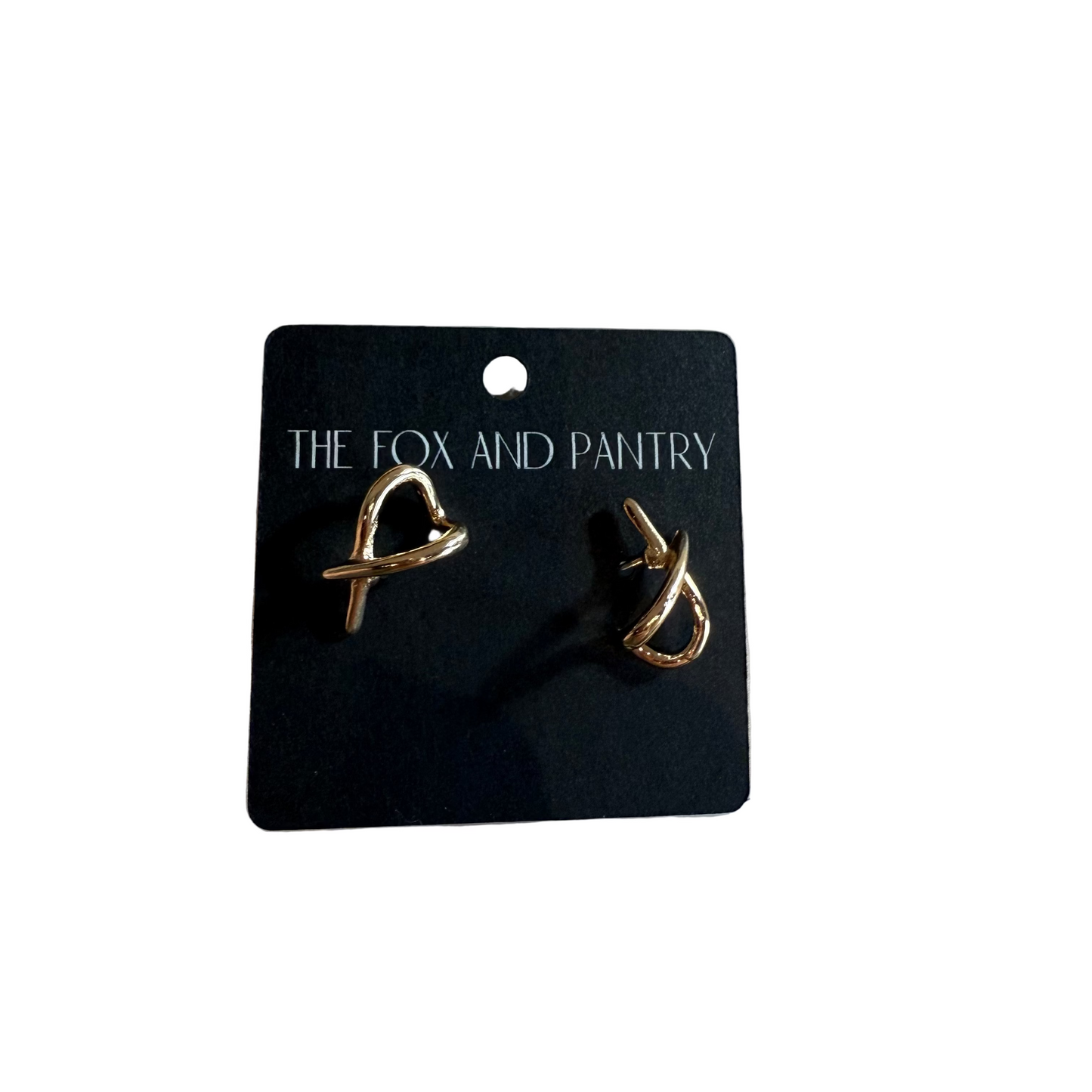 Pair of gold earrings on a 'The Fox and Pantry' branded card.