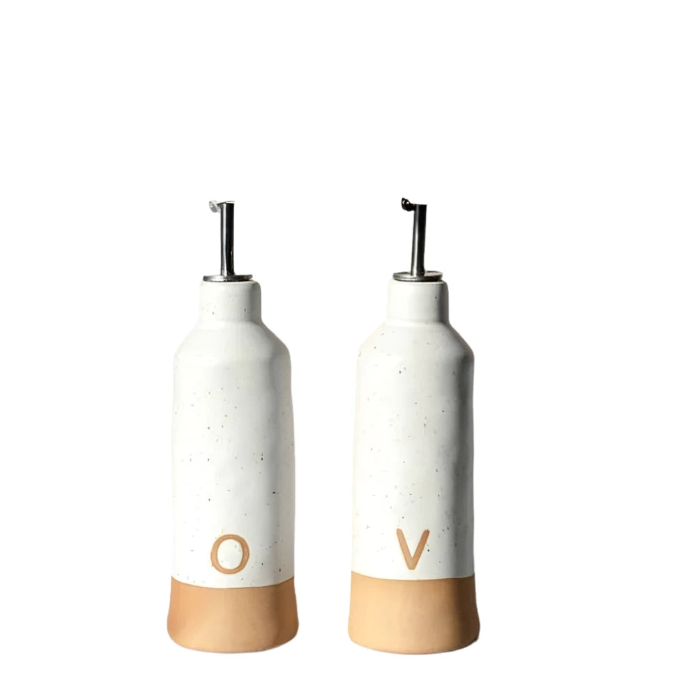 Two white and brown bottles with 'O' and 'V' on a light background
