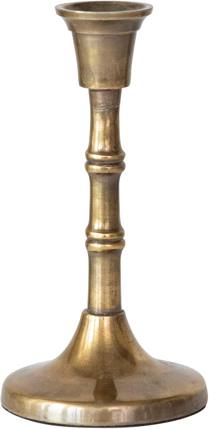 Brass candle holder on a white background