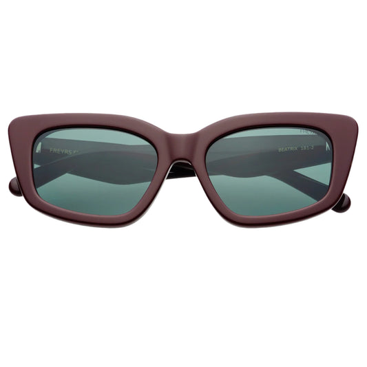 Sunglasses with a maroon frame and dark lenses on a white background