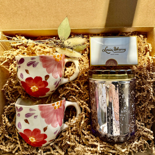 Two floral mugs and a glass jar with decorative elements in a box labeled 'The Fox and Pantry'.
