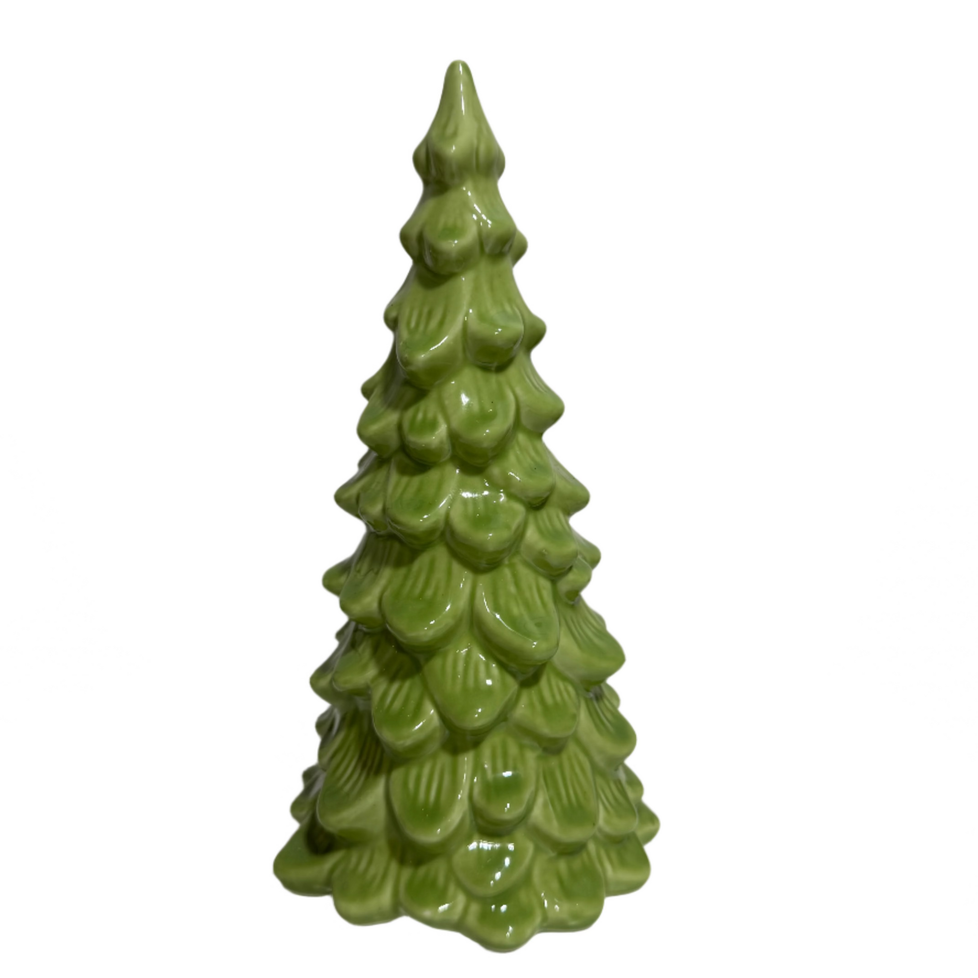 Green ceramic Christmas tree on a white surface with a neutral background