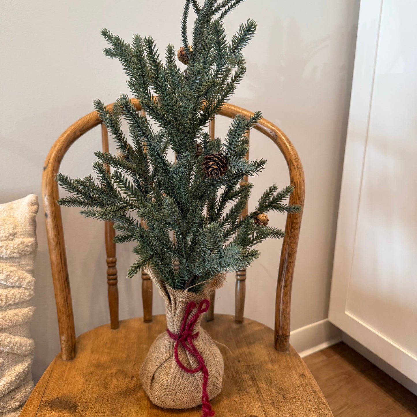 Faux Pine Tree w/ burlap bottom red ribbon (will not ship)