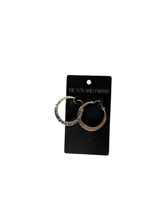Pair of hoop earrings on a 'The Fox and Pantry' branded card against a gray background