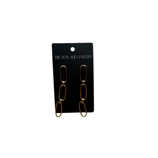Gold chain earrings on a 'The Fox and Pantry' branded card against a white background