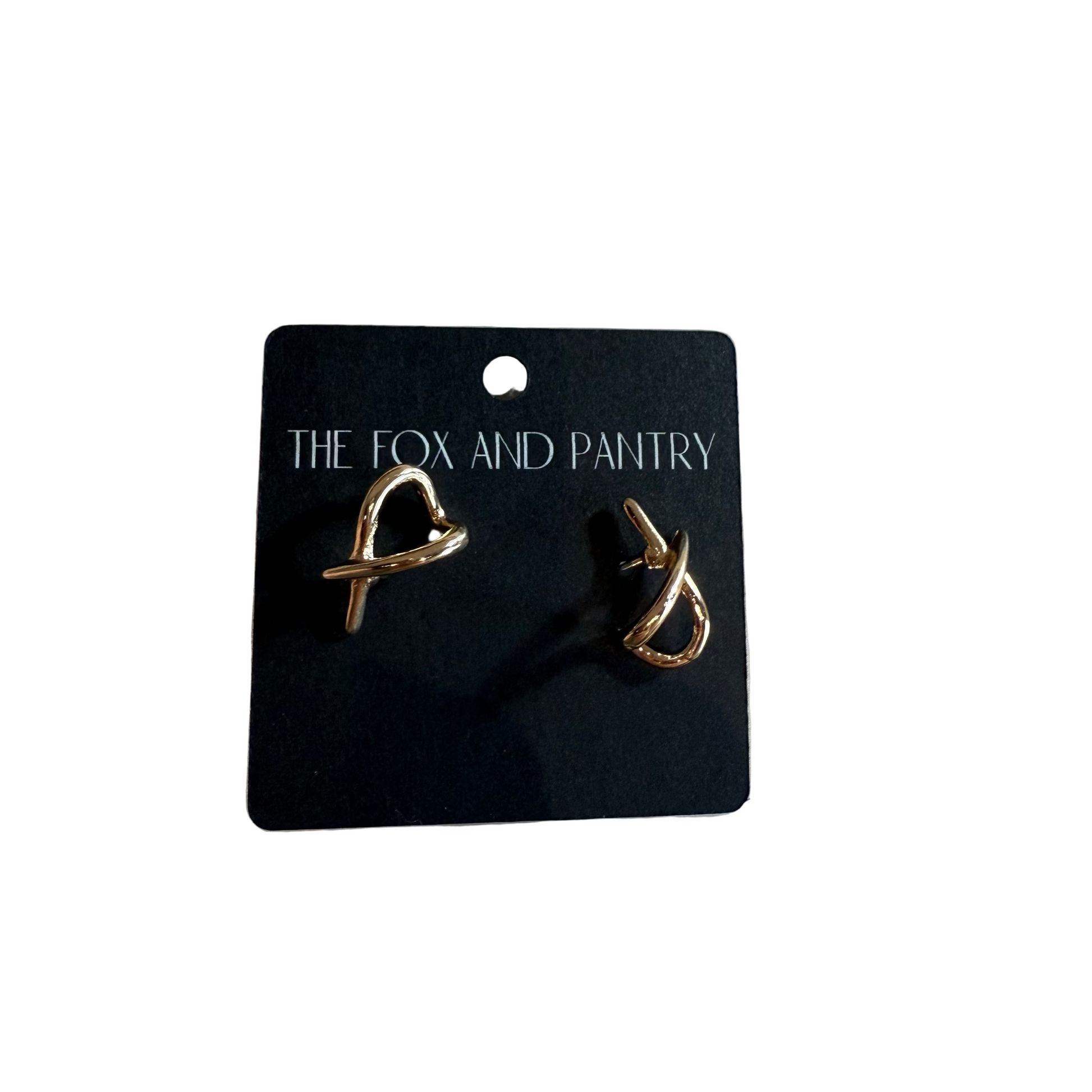 Pair of gold earrings on a 'The Fox and Pantry' branded card.