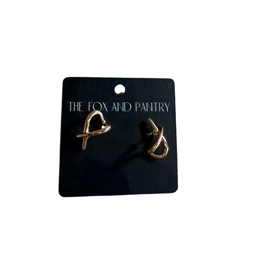 Pair of gold earrings on a 'The Fox and Pantry' branded card.