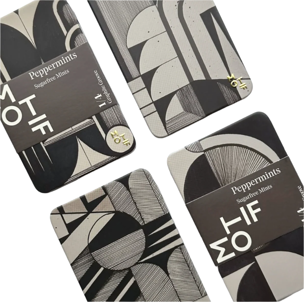 Four black and white patterned tins with 'MOTIF' branding on a light gray background.