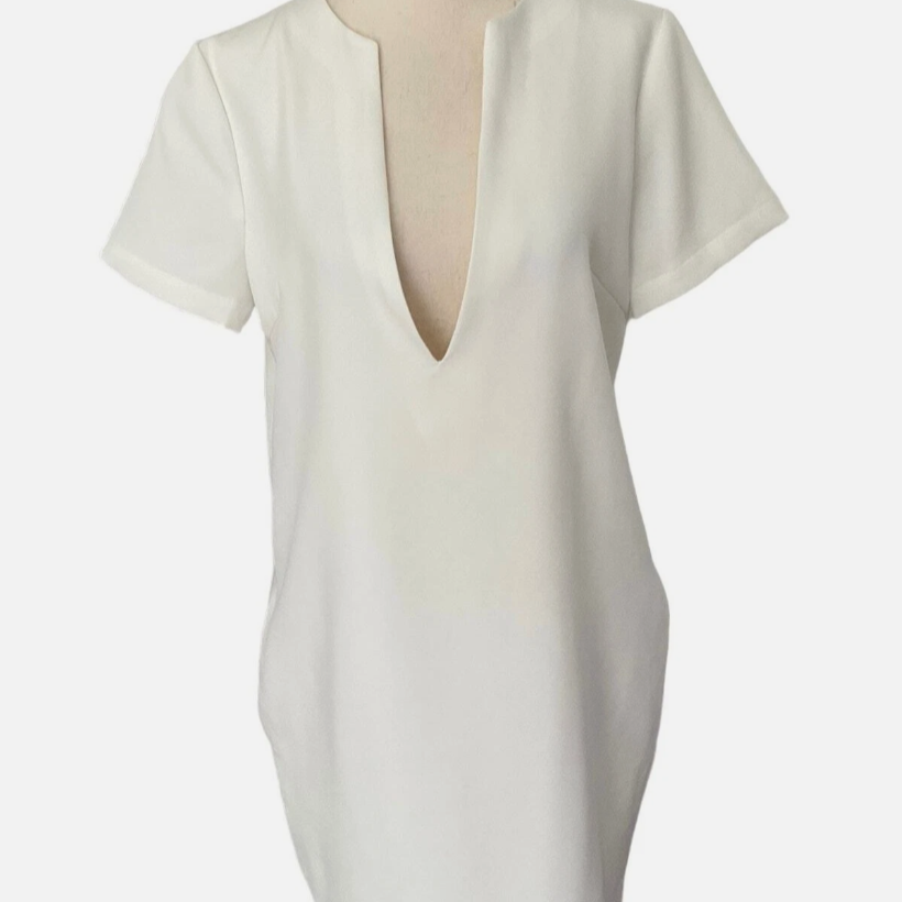 White blouse with a deep neckline on a mannequin against a white background
