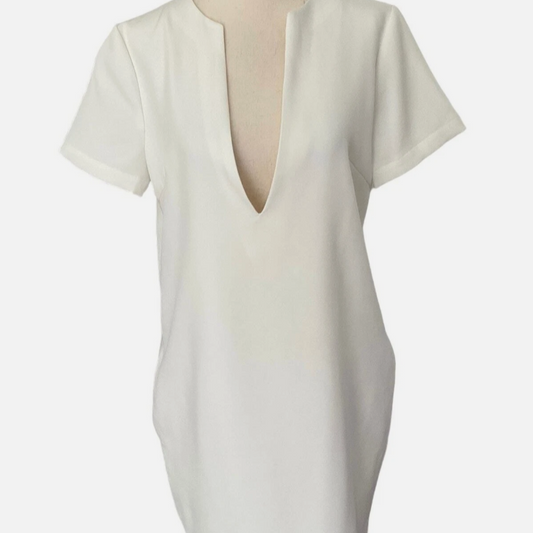 White blouse with a deep neckline on a mannequin against a white background