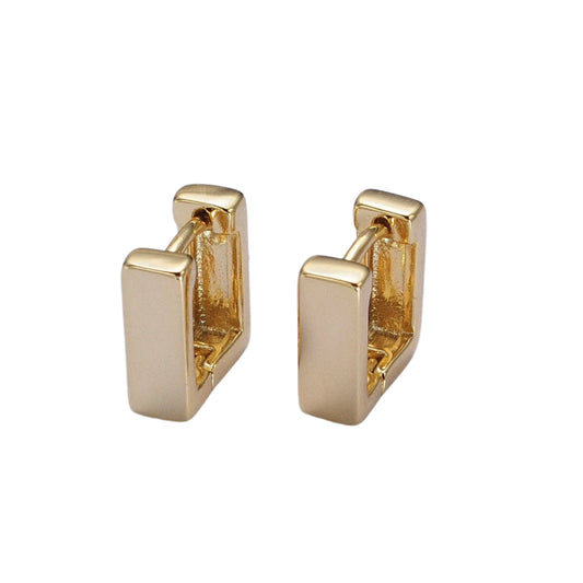 Pair of gold hoop earrings on a light gray background