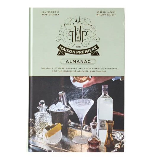 Book titled 'Maison Premiere Almanac' on a beige background