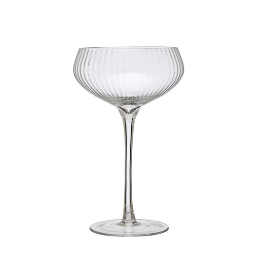 Clear glass cocktail glass on a white background