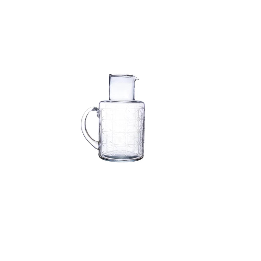 Clear glass carafe on a white background