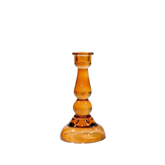 Amber glass candle holder on a white background