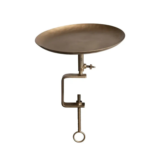 Bronze clamp-style side table on a white background