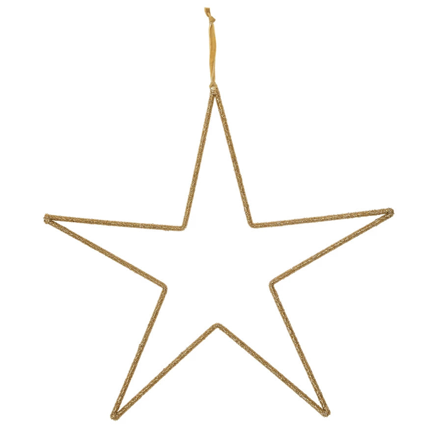 Gold star-shaped ornament on a white background
