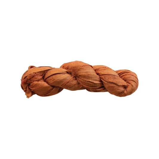 Braided brown rope on a white background